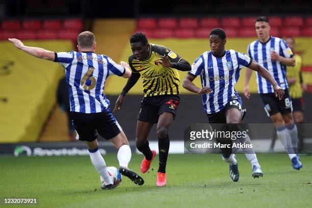 Ismaila Sarr of Watford in action with Sam Hutchinson, Osaze Urhoghide and Joey Pelupessy of Sheffield Wednesday during the Sky Bet Championship...