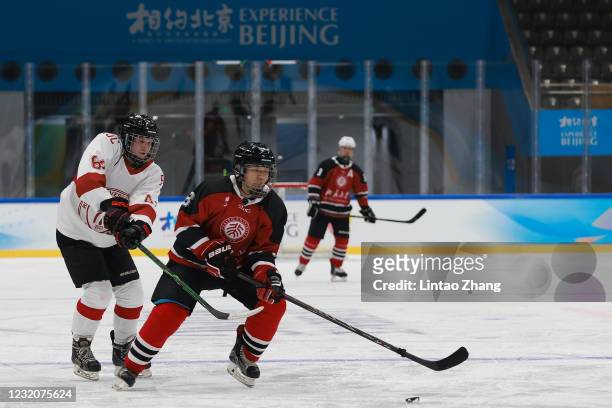 Chinese players from Beijing University and the Renmin University of China during a game at the ice hockey test event for the Beijing 2022 Winter...