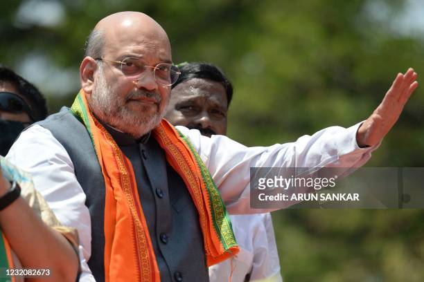 Indias Home Minister and leader of the Bharatiya Janata Party Amit Shah takes part in a roadshow ahead of the Tamil Nadu state legislative assembly...