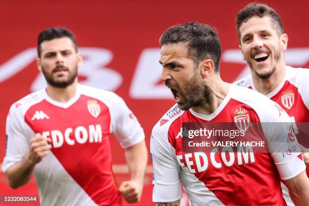 Monaco's Spanish midfielder Cesc Fabregas celebrates with teammates after scoring a goal during the French L1 football match between AS Monaco and FC...