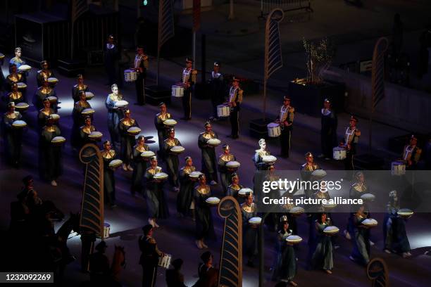 April 2021, Egypt, Cairo: Costumed extras march in front of the Egyptian Museum near Cairo's Tahrir Square during the "Pharaohs' Golden Parade", a...