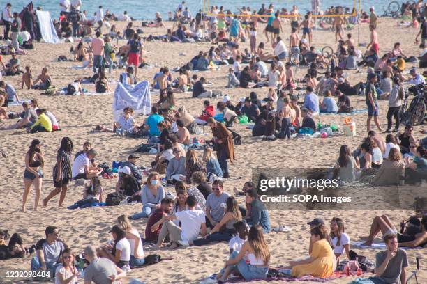 Crowd of people seen on the beach of Barceloneta. The Barceloneta Beach in Barcelona is already crowded. Due to the corona virus pandemic, Catalonia...