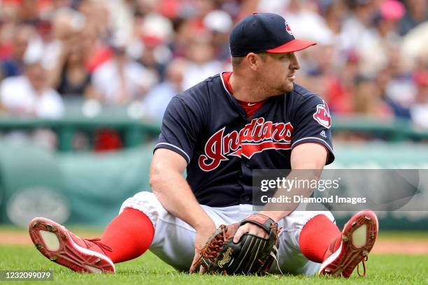 Relief pitcher Bryan Shaw of the Cleveland Indians reacts after committing an error fielding a line drive hit by third baseman Jeimer Candelario of...