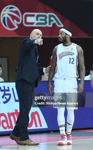 April 3, 2021 -- Shanghai Sharks' head coach Neven Spahija L instructs player Marcus Denmon during the 52nd round match between Beijing Ducks and...