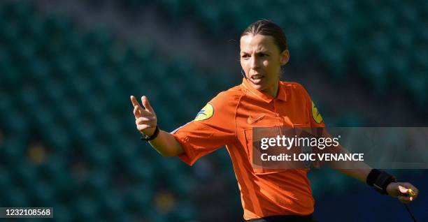 French referee Stephanie Frappart gestures during the French L1 football match between FC Nantes and OGC Nice at the La Beaujoire Stadium in Nantes,...