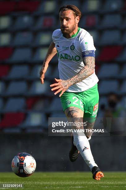 Saint-Etienne's French defender Mathieu Debuchy runs with a ball during the French Ligue 1 football match between Nimes Olympique and AS...