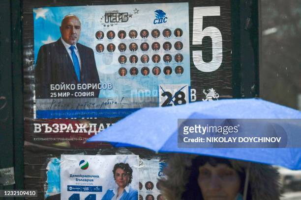 Woman walks past an election poster of Bulgaria's Prime Minister and leader of GERB party Boyko Borisov during the country's parliamentary election...