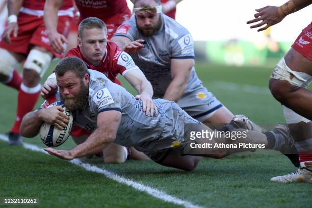 Akker van der Merwe of Sale Sharks scores his sides first try during the Heineken Champions Cup - Round of 16 match between the Scarlets and Sale...