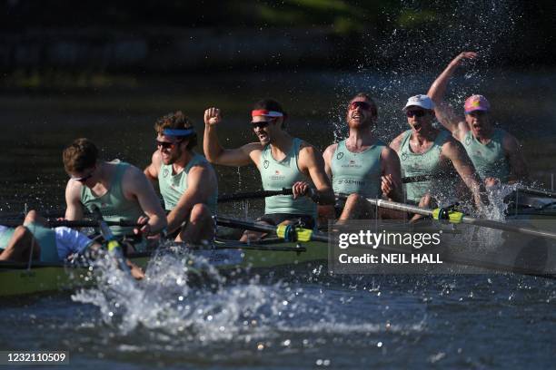 Cambridge crew celebrate their win over Oxford at the finish of the 166th annual men's boat race between Oxford University and Cambridge University...