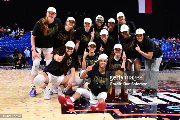 Stanford Cardinal players celebrate with the trophy after their win over the Arizona Wildcats in the championship game of the NCAA Women's Basketball...