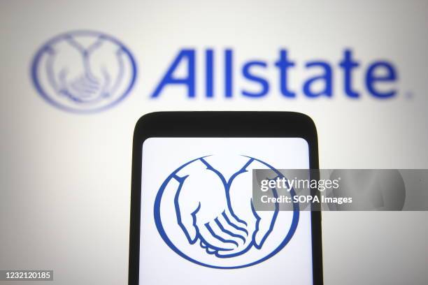 In this photo illustration the Allstate logo of an US insurance company is seen on a smartphone and a pc screen.