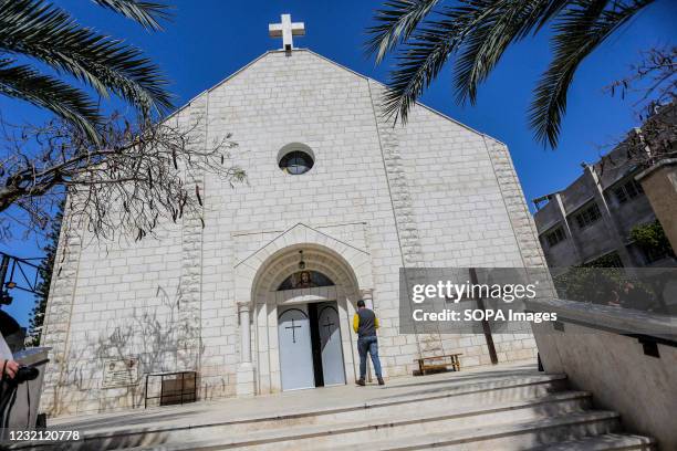 Palestinian Christian man seen at the entrance to the Roman Catholic Church of the Holy Family during the Easter Mass. Easter Vigil, also called the...