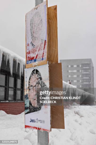 Election campaign posters of Martha Abelsen and Jess Svane of the Siumut party for Greenland's legislative elections hang in the center of Nuuk,...