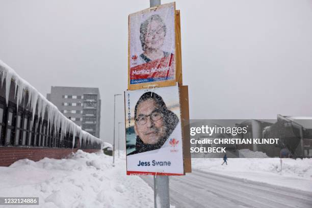 Election campaign posters of Martha Abelsen and Jess Svane of the Siumut party for Greenland's legislative elections hang in the center of Nuuk,...