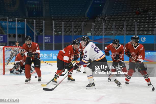 Chinese players from Beijing University and the Renmin University of China during a game at the ice hockey test event for the Beijing 2022 Winter...