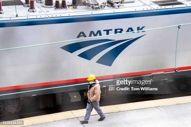 Worker is seen on the Amtrak train platform in Union Station in Washington, D.C., on Thursday, April 1, 2021.