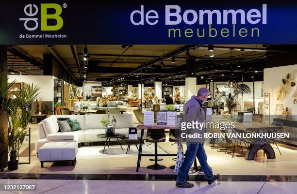 Man walks past a shop at the Woonmall Alexandrium on Easter Monday which is receiving customers by appointment and according to the guidelines of the...