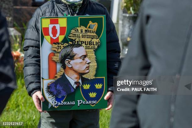 Child holds a picture of Patrick Pearse, one of the leaders of the Easter Rising as republicans gather for a wreath laying ceremony in the city...