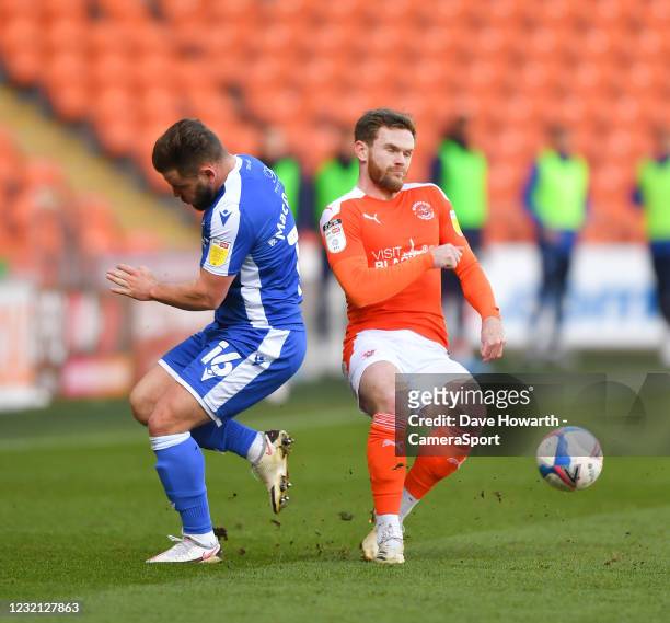 Blackpool's Oliver Turton battles with Gillingham's Alex MacDonald during the Sky Bet League One match between Blackpool and Gillingham at Bloomfield...