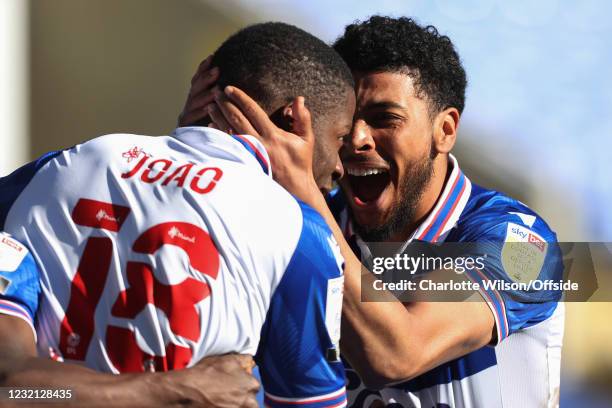 Josh Laurent of Reading celebrates with goalscorer Lucas Joao after Joao scores their 3rd goal during the Sky Bet Championship match between Reading...