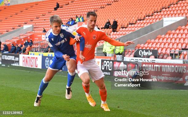 Blackpool's Jerry Yates battles with Gillingham's Stuart O'Keefe during the Sky Bet League One match between Blackpool and Gillingham at Bloomfield...