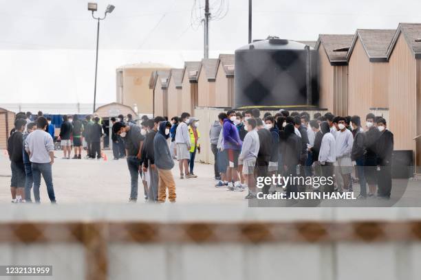 Migrant youths are seen inside the Cotton Logistics oilfield housing that was constructed in 2012 to temporarily house workers in the oil industry in...