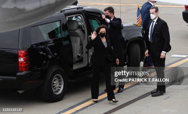 Vice President Kamala Harris waves as she steps out of her motorcade to board Air Force Two at Metro Oakland International Airport on April 5, 2021...