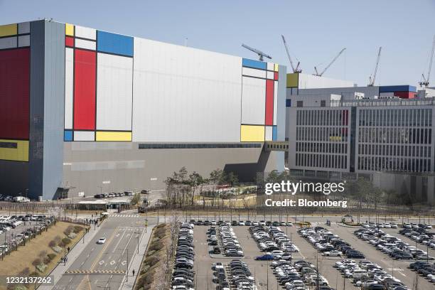 Vehicles are parked in front of the Samsung Electronics Co. Semiconductor manufacturing plant in Pyeongtaek, Gyeonggi Province, South Korea, on...