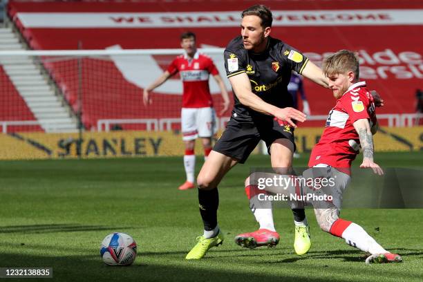 Dan Gosling of Watford in action with Middlesbrough's Hayden Coulson during the Sky Bet Championship match between Middlesbrough and Watford at the...