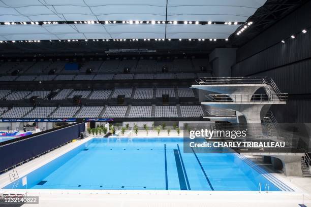 This picture shows a general view of the diving pool at the Tokyo Aquatics Centre - the venue for swimming, diving and artistic swimming at the 2020...