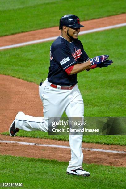 Designated hitter Edwin Encarnacion of the Cleveland Indians reacts after flying out in the sixth inning of game five of the American League Division...