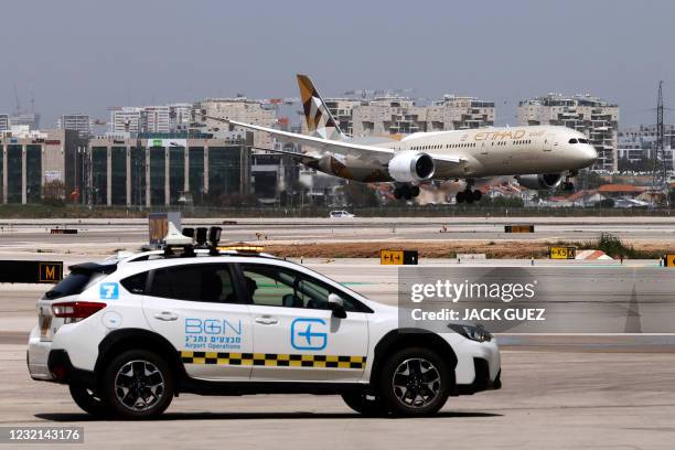 An Etihad Airways Boeing 787-9 "Dreamliner" aircraft lands upon arrival from the United Arab Emirates at Israel's Ben Gurion Airport near Tel Aviv,...