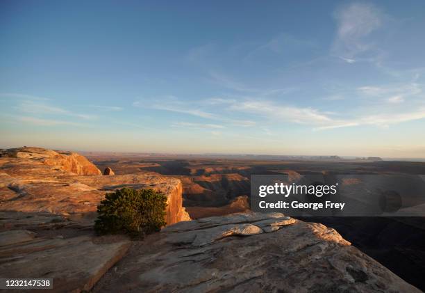 The sun sets over Monument Valley in the distance as seen from the Bears Ears National Monument on April 4, 2021 outside Blanding, Utah. Interior...