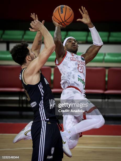 Tony Taylor of Pinar Karsiyaka in action against Josh Bostic of Happy Casa Brindisi during FIBA Champions League play-off Group I match bertween...
