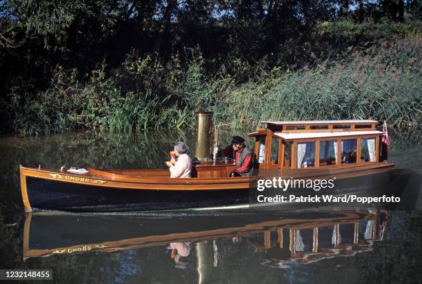 Afternoon tea on the Edwardian steam launch "Churr" as she cruises near Buscot on the River Thames, circa June 2002. An image from Patrick Ward's...