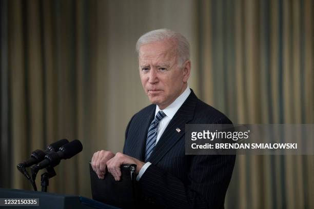 President Joe Biden takes questions from the media after he delivered remarks on a vaccination update from the State Dining Room at The White House,...