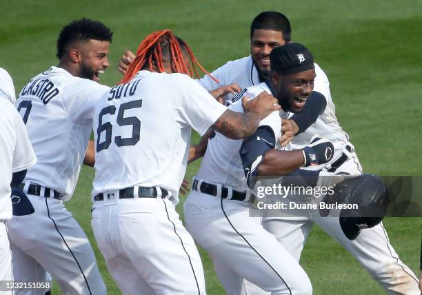 Akil Baddoo of the Detroit Tigers, right, celebrates with Willi Castro, Gregory Soto and Jeimer Candelario after hitting a single to drive in Harold...