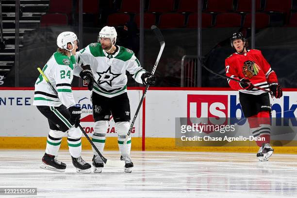 Roope Hintz and Andrew Cogliano of the Dallas Stars celebrate after Cogliano scored a goal in the third period against the Chicago Blackhawks at the...