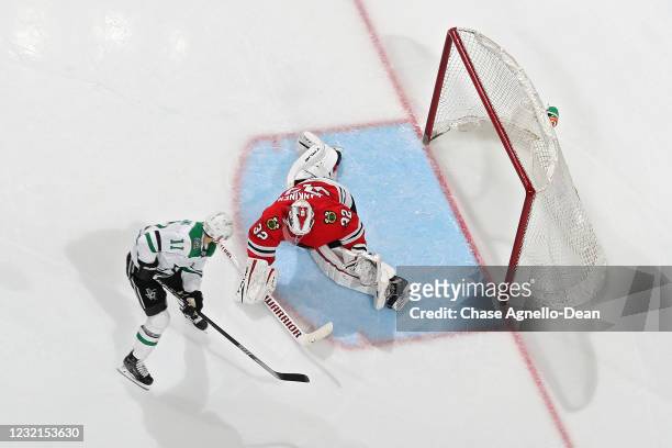 Andrew Cogliano of the Dallas Stars scores a goal past Kevin Lankinen of the Chicago Blackhawks in the third period at the United Center on April 06,...