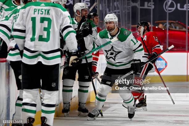 Andrew Cogliano of the Dallas Stars celebrates with teammates after scoring a goal in the third period against the Chicago Blackhawks at the United...