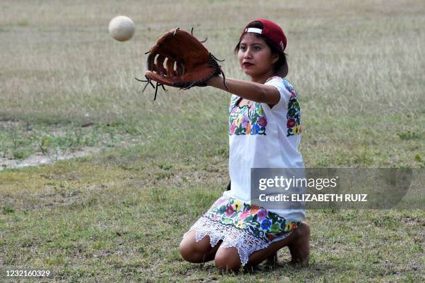 Player of "Las Diablillas de Hondzonot", catches the ball during a match against "Guerreras de Piste", in Hondzonot, municipality of Tulum, Quintana...