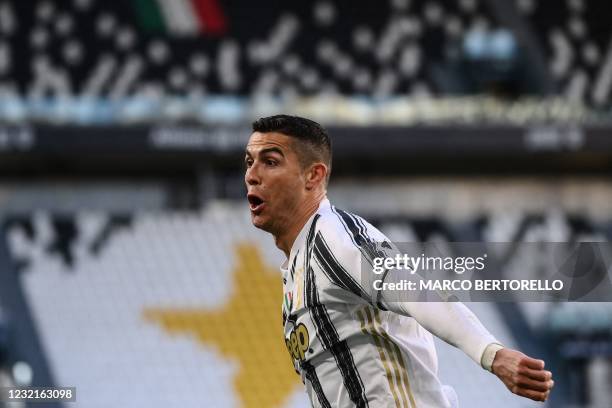 Juventus' Portuguese forward Cristiano Ronaldo celebrates after opening the scoring during the Italian Serie A football match Juventus vs Napoli on...