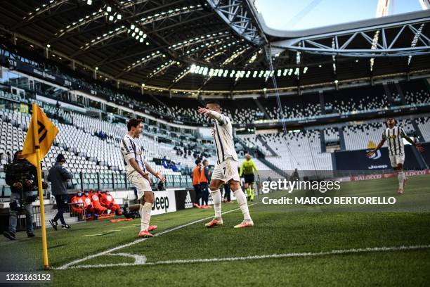 Juventus' Portuguese forward Cristiano Ronaldo celebrates with Juventus' Italian forward Federico Chiesa after opening the scoring during the Italian...
