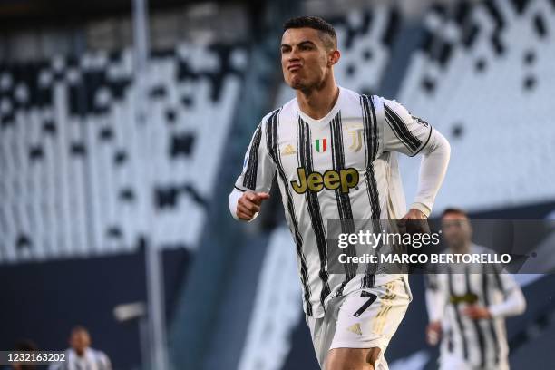 Juventus' Portuguese forward Cristiano Ronaldo celebrates after opening the scoring during the Italian Serie A football match Juventus vs Napoli on...