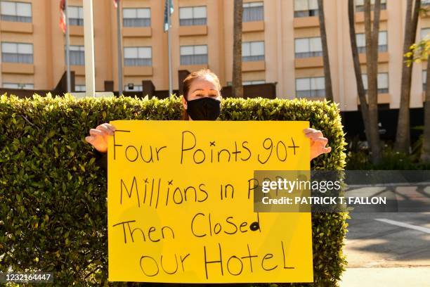 Worker protests outside the closed Four Points by Sheraton LAX hotel as they call for an investigation by the US Small Business Administration into...