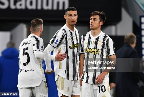 Paulo Dybala of Juventus celebrates at full time with Cristiano Ronaldo of Juventus and Arthur of Juventus during the Serie A match between Juventus...
