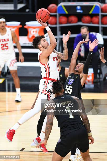 Utah Utes forward Timmy Allen drives to the basket during the first round game of the men's Pac-12 Tournament between the Utah Utes and the...