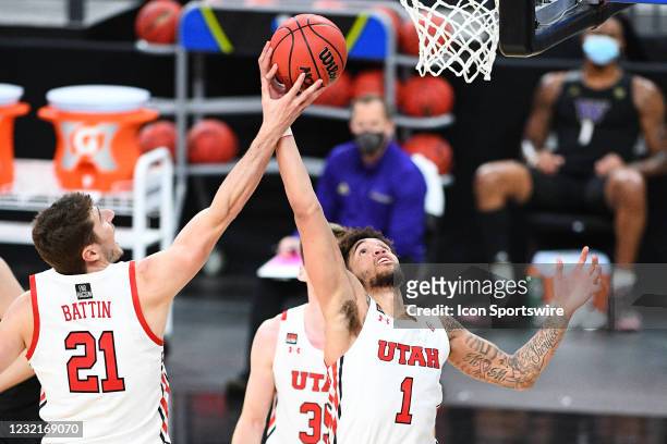 Utah Utes forward Riley Battin and Utah Utes forward Timmy Allen battle for a rebound during the first round game of the men's Pac-12 Tournament...