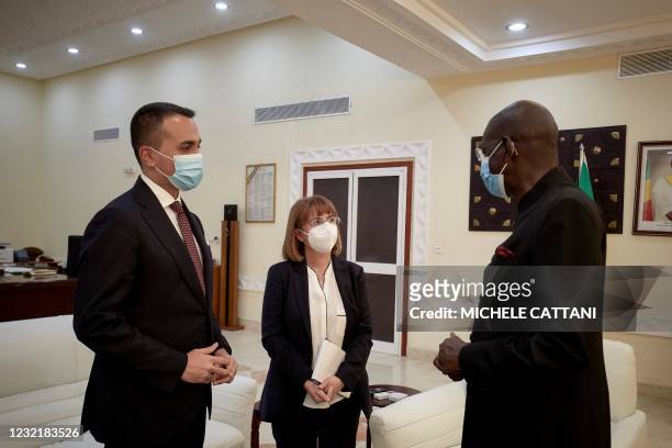 Mali's Prime Minister Moctar Ouane welcomes Italian foreign Minister Luigi Di Maio prior to a bilateral meeting as part of a visit, in Bamako, on...