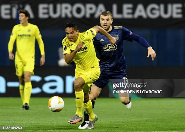 Villarreal's Argentinian defender Juan Foyth is challenged by Dinamo Zagreb's North Macedonian defender Stefan Ristovski during the UEFA Europa...